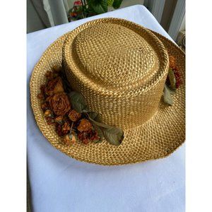 Straw hat with orange flowers